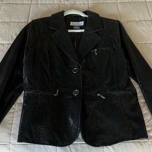 Leather jacket. Patterned. Black. Size large. Never worn